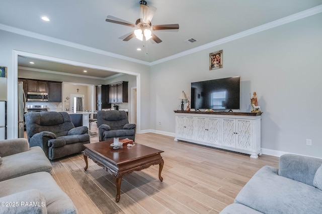111 Rose Of Sharon Ln, Lafayette, LA 70508 - living area featuring a ceiling fan, light wood-style floors, baseboards, crown molding, and recessed lighting