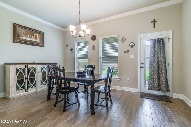 111 Rose Of Sharon Ln, Lafayette, LA 70508 - dining room with a chandelier, crown molding, dark wood-style floors, and baseboards