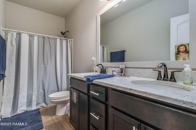111 Rose Of Sharon Ln, Lafayette, LA 70508 - full bath featuring double vanity, toilet, wood finished floors, and shower / tub combo