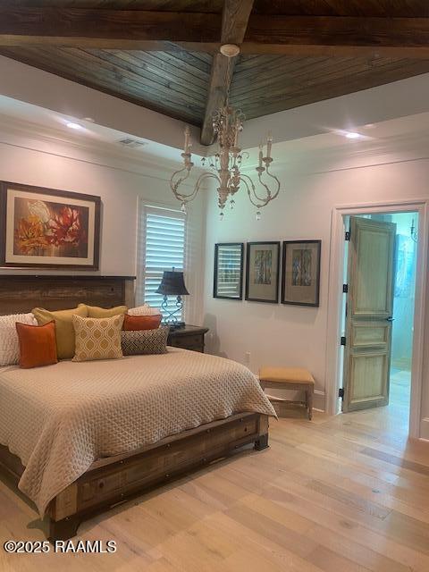 207 Bronze Palm Way, Youngsville, LA 70592 - bedroom featuring a chandelier, light wood finished floors, and crown molding