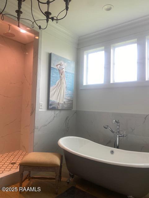 207 Bronze Palm Way, Youngsville, LA 70592 - full bathroom featuring ornamental molding, tile walls, a freestanding bath, and a shower