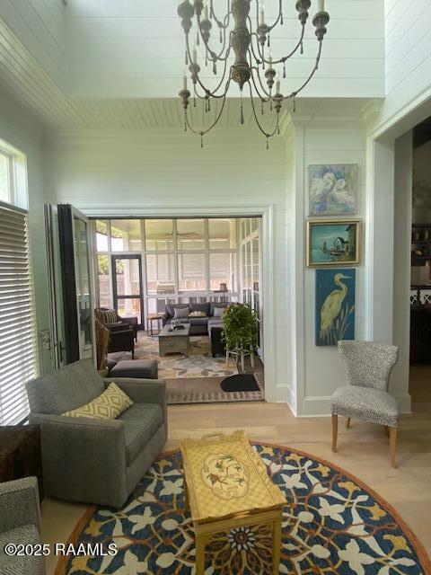 207 Bronze Palm Way, Youngsville, LA 70592 - living area with a chandelier and wood finished floors