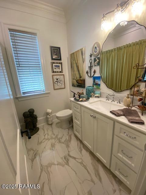 207 Bronze Palm Way, Youngsville, LA 70592 - bathroom featuring marble look tiles, vanity, toilet, crown molding, and baseboards