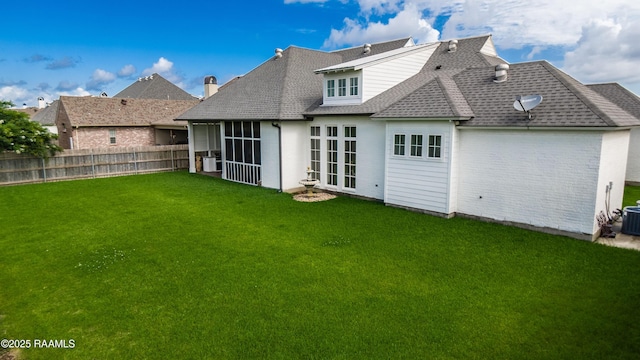 207 Bronze Palm Way, Youngsville, LA 70592 - back of house featuring a shingled roof and a sunroom