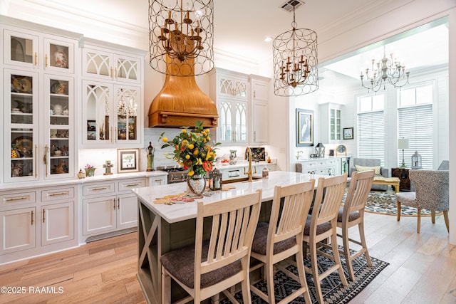 207 Bronze Palm Way, Youngsville, LA 70592 - dining area featuring ornamental molding, light wood-style flooring, a chandelier, and recessed lighting