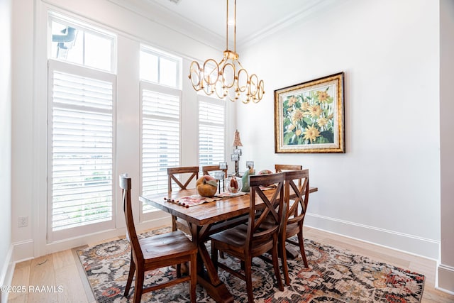 207 Bronze Palm Way, Youngsville, LA 70592 - dining room with a chandelier, crown molding, wood finished floors, and healthy amount of natural light