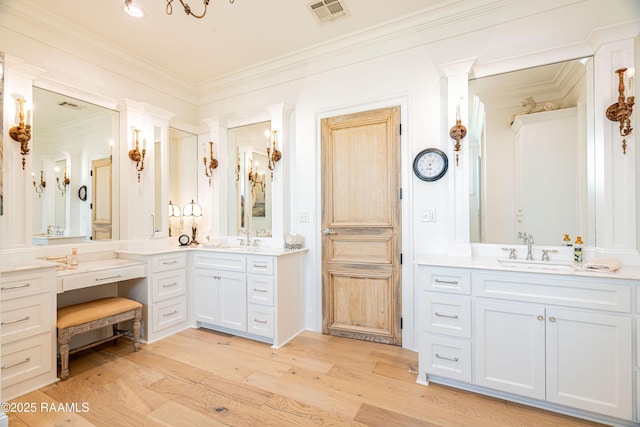 207 Bronze Palm Way, Youngsville, LA 70592 - full bathroom with two vanities, wood finished floors, and crown molding