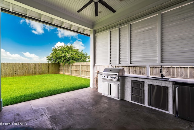 207 Bronze Palm Way, Youngsville, LA 70592 - fenced backyard with exterior kitchen, a patio, and a ceiling fan