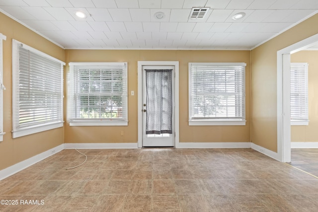 206 N Fernand St, Delcambre, LA 70528 - foyer entrance with crown molding, plenty of natural light, baseboards, and recessed lighting