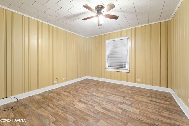 206 N Fernand St, Delcambre, LA 70528 - spare room with ceiling fan, ornamental molding, wood finished floors, and baseboards