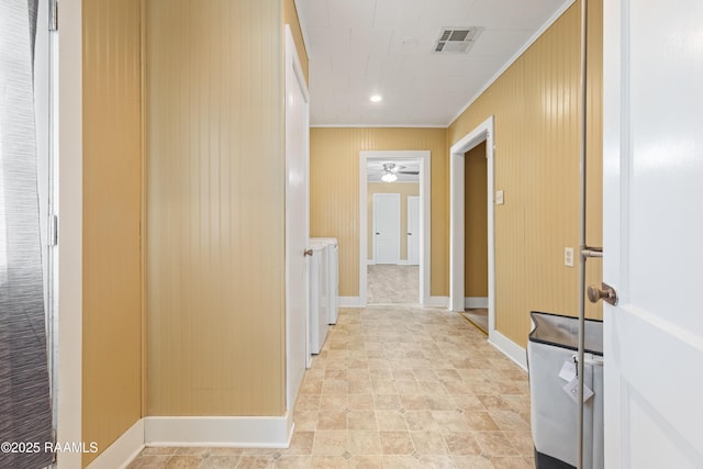 206 N Fernand St, Delcambre, LA 70528 - hall with ornamental molding, baseboards, and washer / clothes dryer