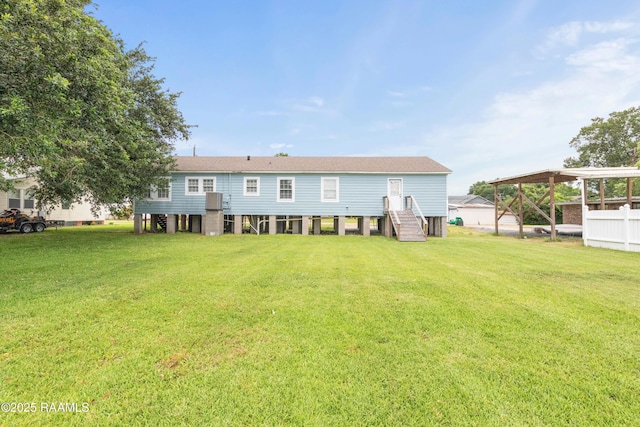 206 N Fernand St, Delcambre, LA 70528 - rear view of house with a lawn