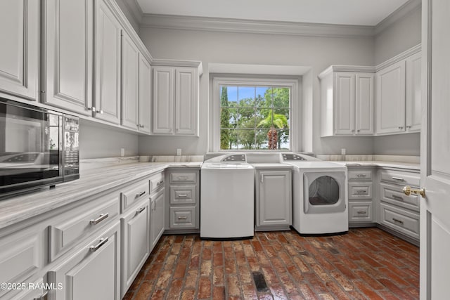 12425 N Marcus Rd, Abbeville, LA 70510 - washroom featuring cabinet space, washing machine and dryer, brick floors, and ornamental molding
