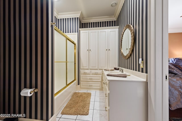 12425 N Marcus Rd, Abbeville, LA 70510 - ensuite bathroom featuring ornamental molding, vanity, wallpapered walls, enclosed tub / shower combo, and tile patterned floors