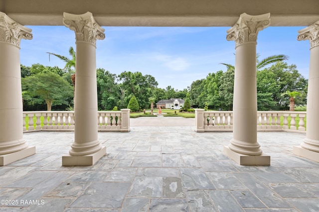 12425 N Marcus Rd, Abbeville, LA 70510 - covered porch with view of scattered trees