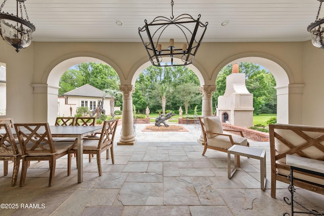 12425 N Marcus Rd, Abbeville, LA 70510 - view of patio / terrace with an outdoor fireplace and outdoor dining area