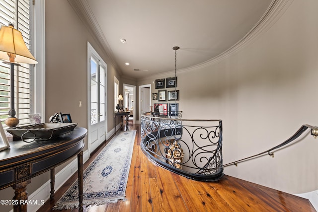12425 N Marcus Rd, Abbeville, LA 70510 - corridor with crown molding, wood-type flooring, an upstairs landing, and recessed lighting