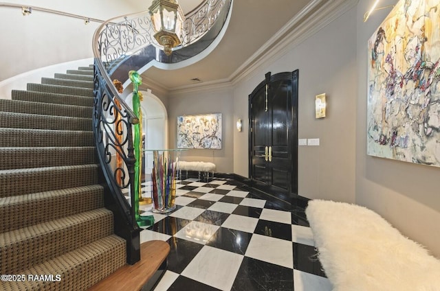 12425 N Marcus Rd, Abbeville, LA 70510 - foyer featuring ornamental molding and stairway