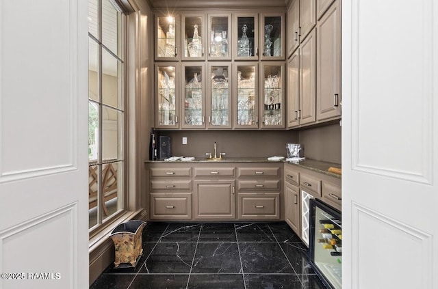 12425 N Marcus Rd, Abbeville, LA 70510 - indoor wet bar with dark marble finish flooring and beverage cooler