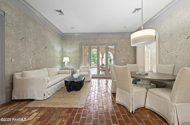 12425 N Marcus Rd, Abbeville, LA 70510 - living room featuring brick floors, french doors, wallpapered walls, and crown molding