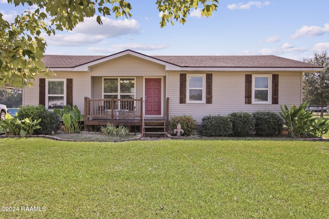 1037 Joe Kidder Rd, Arnaudville, LA 70512 - ranch-style house with a front yard, roof with shingles, and covered porch