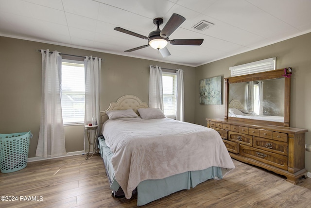 1037 Joe Kidder Rd, Arnaudville, LA 70512 - bedroom featuring crown molding, wood finished floors, and a ceiling fan
