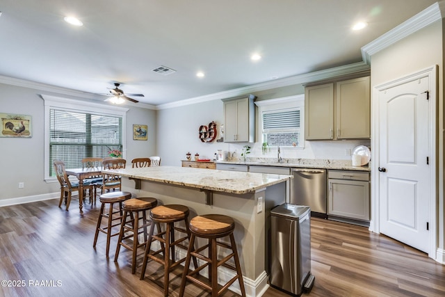 604 Bay Meadow Ln, Lafayette, LA 70507 - kitchen with stainless steel dishwasher, gray cabinetry, healthy amount of natural light, a kitchen island, and ornamental molding