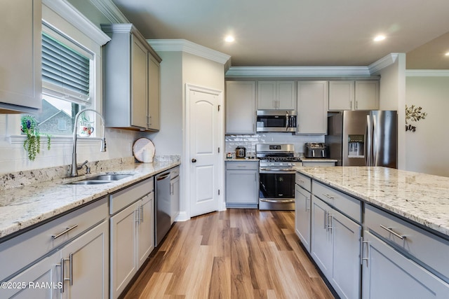 604 Bay Meadow Ln, Lafayette, LA 70507 - kitchen with appliances with stainless steel finishes, a sink, gray cabinets, crown molding, and recessed lighting
