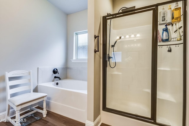 604 Bay Meadow Ln, Lafayette, LA 70507 - bathroom featuring a bath, a shower stall, and wood finished floors