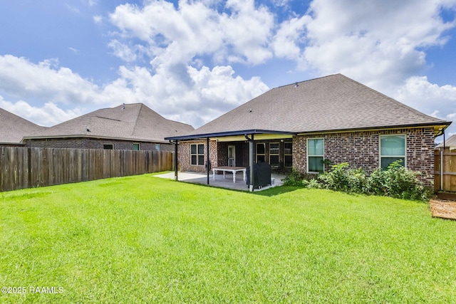 604 Bay Meadow Ln, Lafayette, LA 70507 - back of property featuring a patio area, brick siding, and roof with shingles