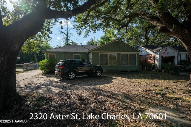 718 14th St, Lake Charles, LA 70601 - view of front of house with board and batten siding