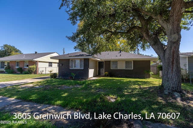 718 14th St, Lake Charles, LA 70601 - ranch-style house with brick siding and concrete driveway