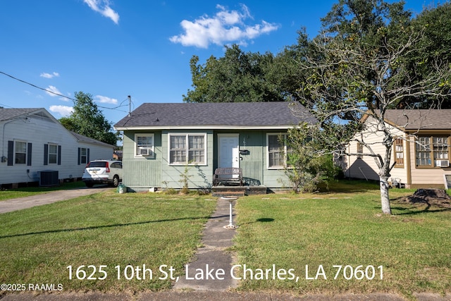 718 14th St, Lake Charles, LA 70601 - view of front of home with a front yard, central AC, and a shingled roof