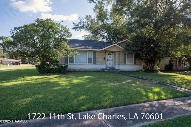 718 14th St, Lake Charles, LA 70601 - view of front of property with a front yard and brick siding