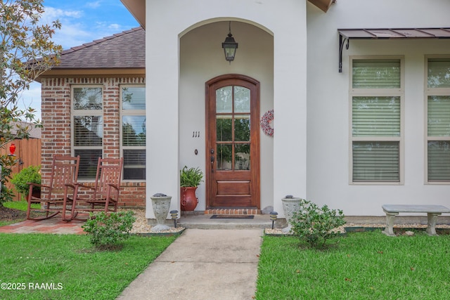 111 Grand Pointe Blvd, Lafayette, LA 70508 - entrance to property with stucco siding, brick siding, and a shingled roof