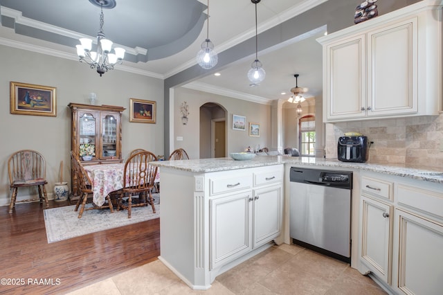 111 Grand Pointe Blvd, Lafayette, LA 70508 - kitchen with stainless steel dishwasher, a peninsula, arched walkways, a chandelier, and ornamental molding