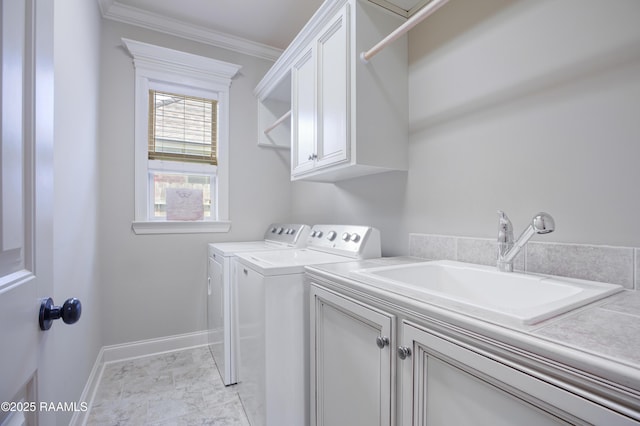 111 Grand Pointe Blvd, Lafayette, LA 70508 - laundry room featuring cabinet space, washer and dryer, crown molding, baseboards, and light marble finish flooring