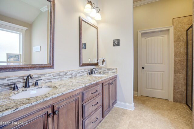 111 Grand Pointe Blvd, Lafayette, LA 70508 - bathroom featuring double vanity, a tile shower, baseboards, tasteful backsplash, and ornamental molding