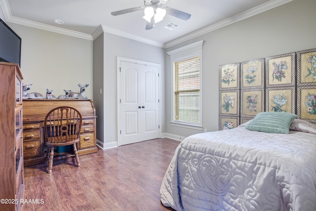 111 Grand Pointe Blvd, Lafayette, LA 70508 - bedroom with wood finished floors, crown molding, baseboards, ceiling fan, and a closet