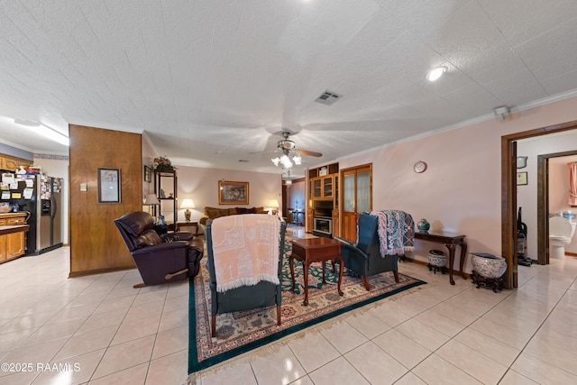 510 Monarch Dr, Lafayette, LA 70506 - living area with crown molding, ceiling fan, and light tile patterned floors