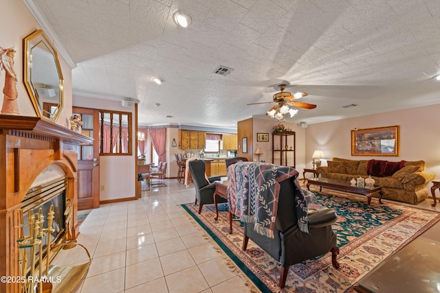 510 Monarch Dr, Lafayette, LA 70506 - living area with ornamental molding, a ceiling fan, light tile patterned floors, and baseboards