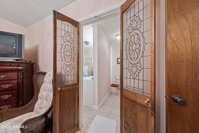 510 Monarch Dr, Lafayette, LA 70506 - foyer with ornamental molding, light tile patterned flooring, a textured ceiling, and baseboards