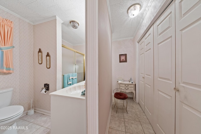 510 Monarch Dr, Lafayette, LA 70506 - bathroom with crown molding, vanity, toilet, wallpapered walls, and tile patterned floors