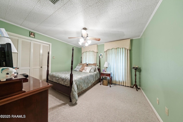 510 Monarch Dr, Lafayette, LA 70506 - carpeted bedroom featuring ornamental molding, a closet, ceiling fan, and baseboards
