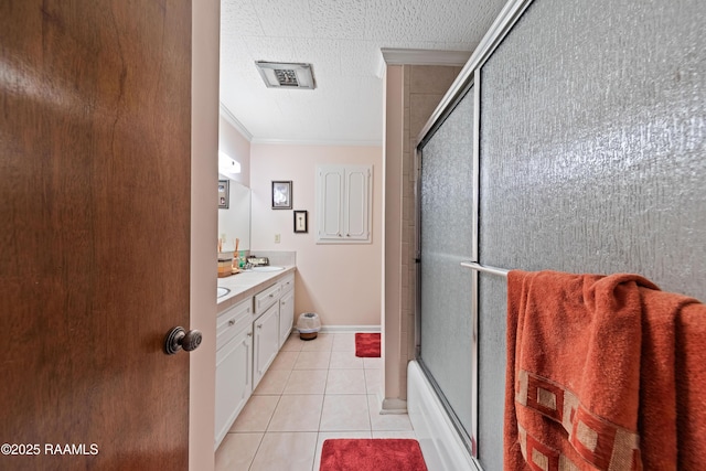 510 Monarch Dr, Lafayette, LA 70506 - bathroom featuring vanity, crown molding, tile patterned flooring, baseboards, and enclosed tub / shower combo