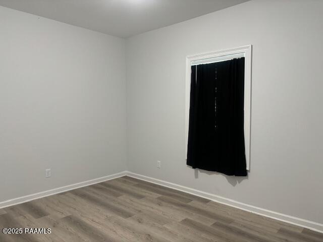 214 Dufilho Rd, Opelousas, LA 70570 - empty room featuring wood finished floors and baseboards