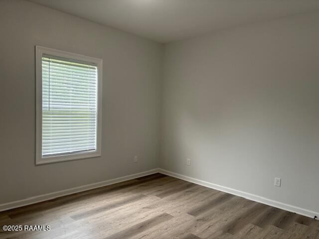 214 Dufilho Rd, Opelousas, LA 70570 - spare room with wood finished floors and baseboards