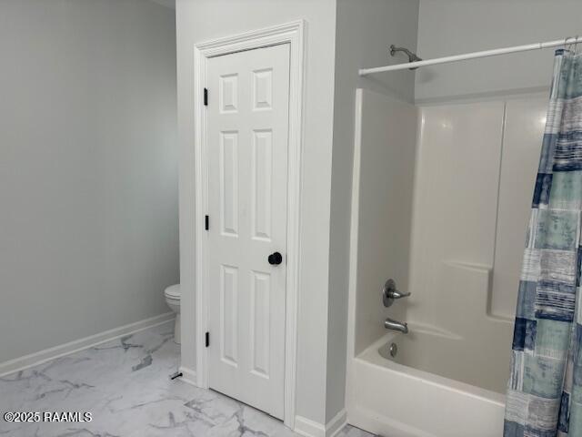 214 Dufilho Rd, Opelousas, LA 70570 - bathroom with shower / tub combo, toilet, marble finish floors, and baseboards