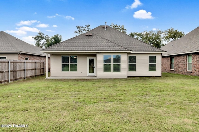 406 Elwick Dr, Lafayette, LA 70507 - back of property featuring roof with shingles and a patio