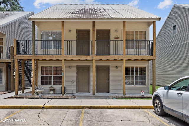 300 Lozes Ave Apt 1503, Lafayette, LA 70508 - multi unit property featuring uncovered parking, metal roof, and a balcony
